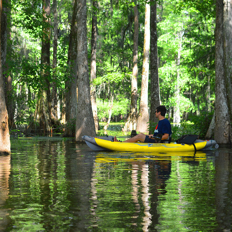 man sitting peacefully in a shady waterway on the StraightEdge Kayak