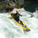 A paddler using the StraightEdge in white water rapids