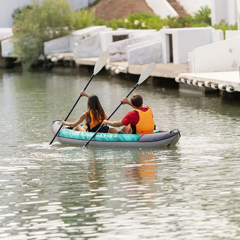 a photo of 2 people paddling the laxo 380 inflatable kayak