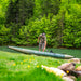 photo of fisherman getting ready to launch the Caliber 398 inflatable fishing kayak