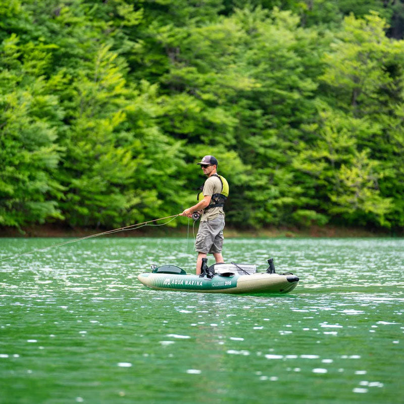 photo of man standing and fishing from the Caliber 398 inflatable fishing kayak