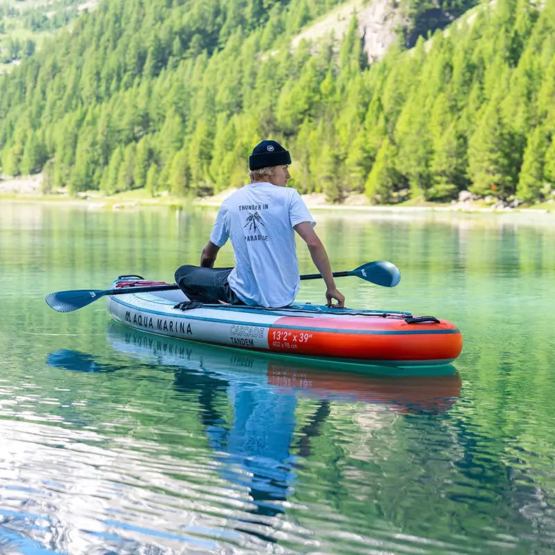 a picture of a man sitting on the Cascade Hybrid Kayak 