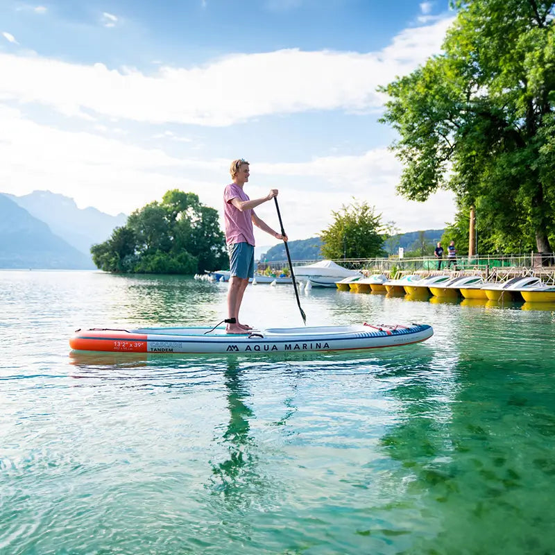 an image of a man using the cascade hybrid watercraft as a standup paddleboard