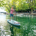 A picture of a man using the Tandem version of the Cascade Hybrid Kayak SUP as a standup paddleboard