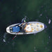 Image from a drone of man fishing on the Drift Inflatable Fishing SUP