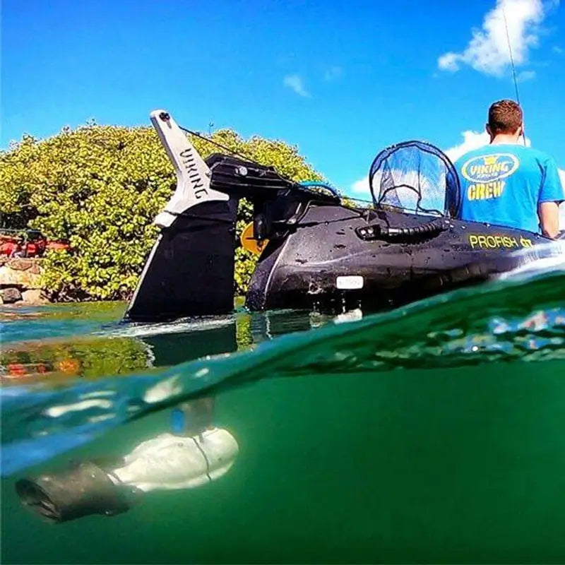 An under water photo of the J2 kayak motor mounted onto the rudder of a viking Profish GT