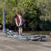 A photo of a man inflating the Quest Angler Inflatable Fishing Kayak