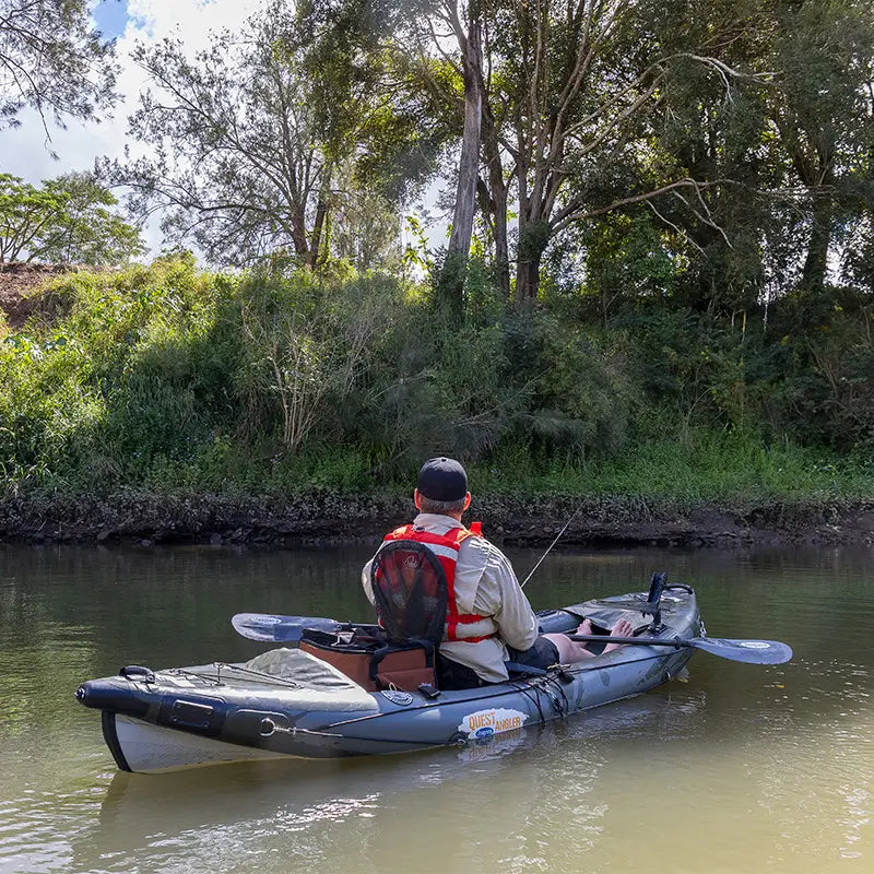 A photo of a man fishing on a river from the Quest Angler Inflatable Fishing Kayak