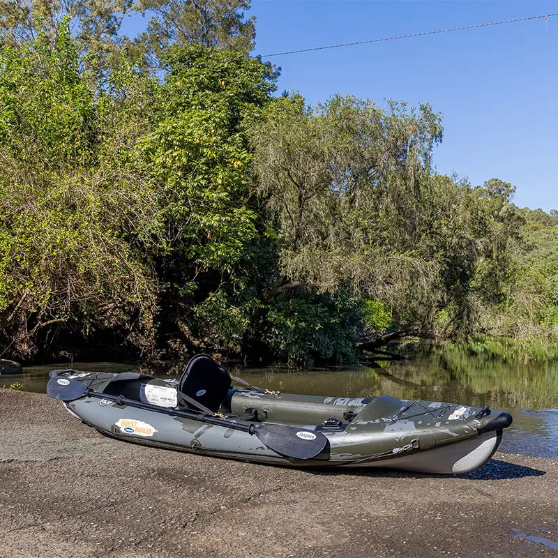A hero shot of the Quest Angler Fishing Kayak beside the water ready for paddling