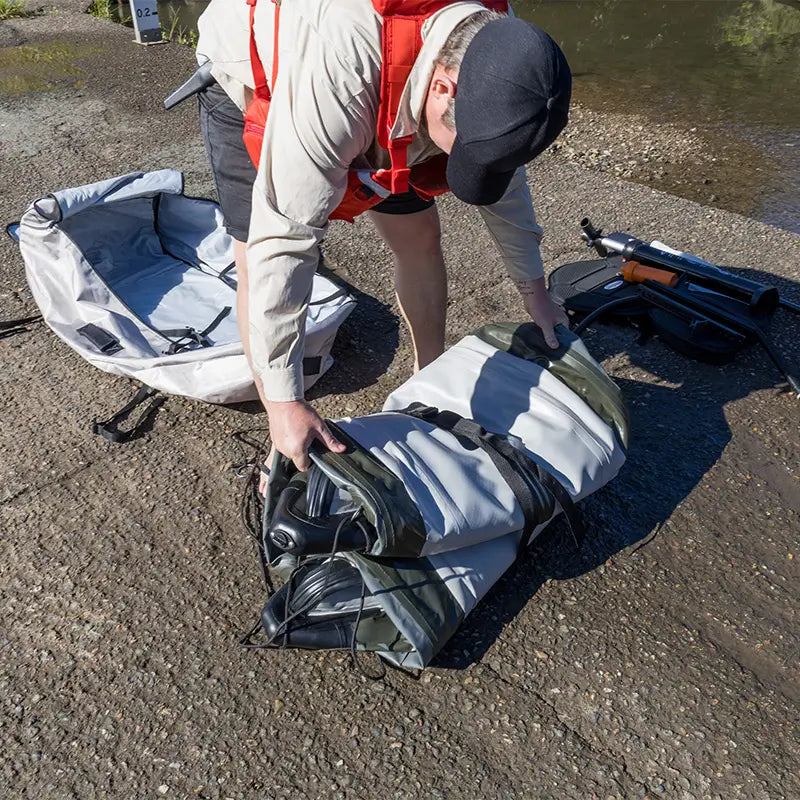 A photo of the Quest Angler Inflatable Fishing Kayak rolled up ready for setup 