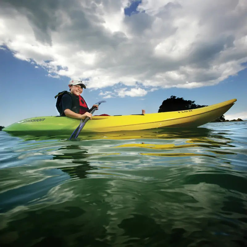 Boy paddling the Mission Flow Kayak