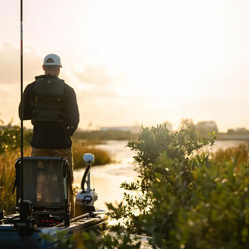 a man fishing with a bow mounted motor on the titan x propel 125 fishing kayak