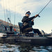 A low shot looking up a a man casting his fishing rod from the Numbered feature map of the stern on the Titan X Propel 10.5 fishing kayak