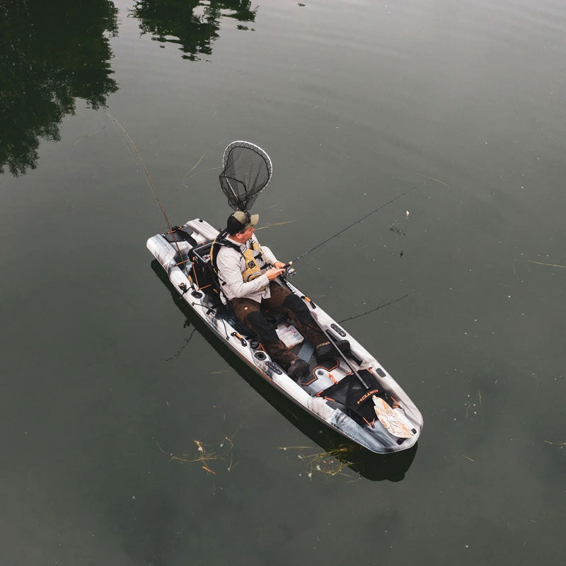 Drone shot of a man fishing in a lake on the catch 110 mode kayak