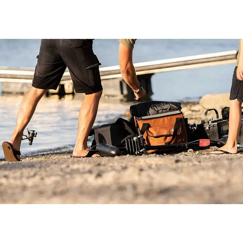 A lifestyle image of the Exocrate Kayak Fishing Crate Bag in use on the beach 