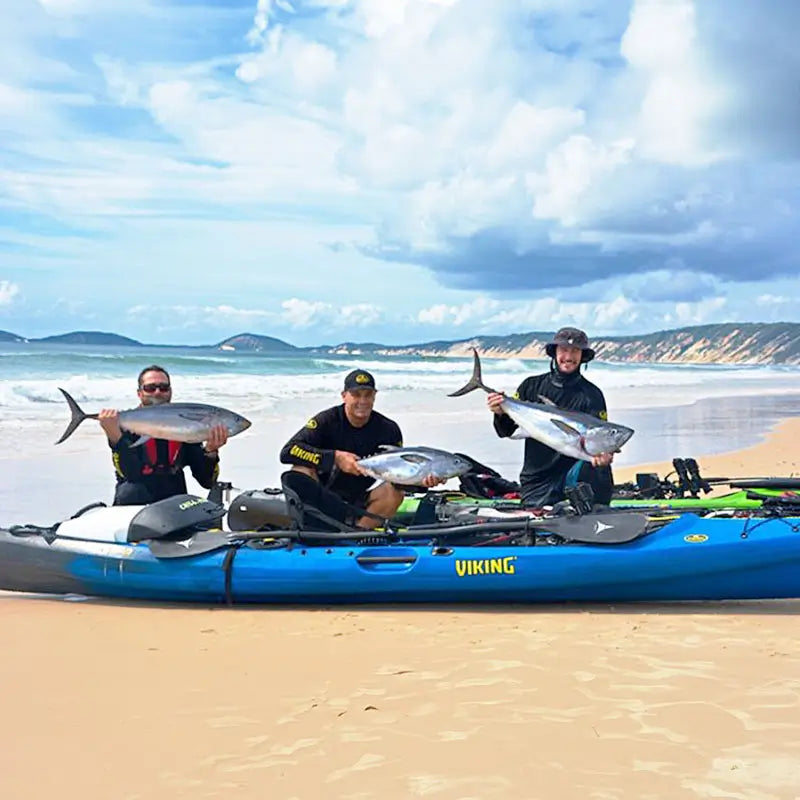 Image of fishermen on a beach with the Viking Profish Reload and paddles