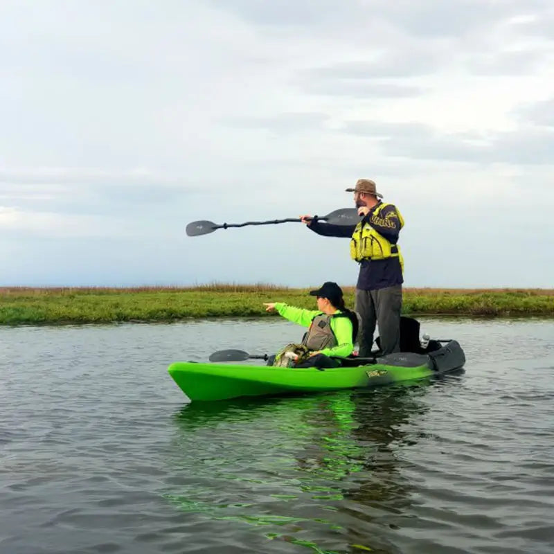 Image of a man standing and woman sitting in the Tempo2 Fishing Kayak from Viking